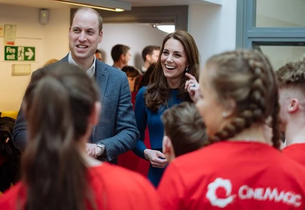 Kate Middleton wore Mulberry blue Ashleigh cape coat and a new Jenny Packham dress.The Duchess is wearing a cape coat by Mulberry