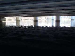 ruffled water surface creates surreal patterns under Seattle freeway, Nigel Foster