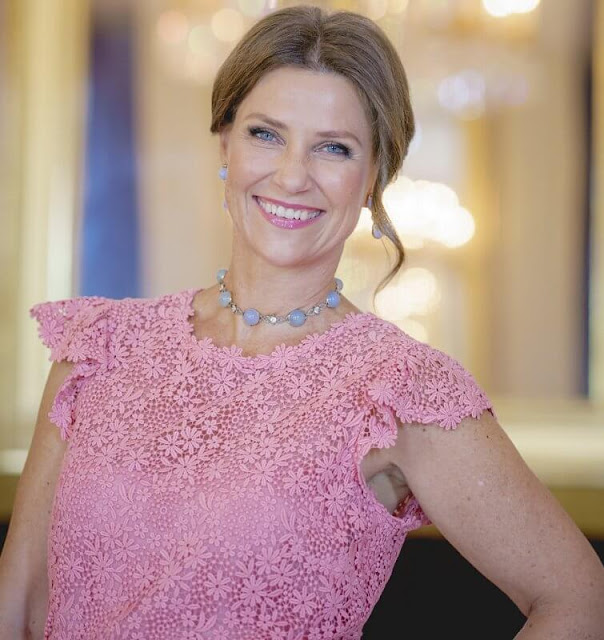 Princess Martha Louise wore a pink lace dress by Valentino. Emilio Pucci blue lace blouse. Crown Princess Mette-Marit wore the same dress