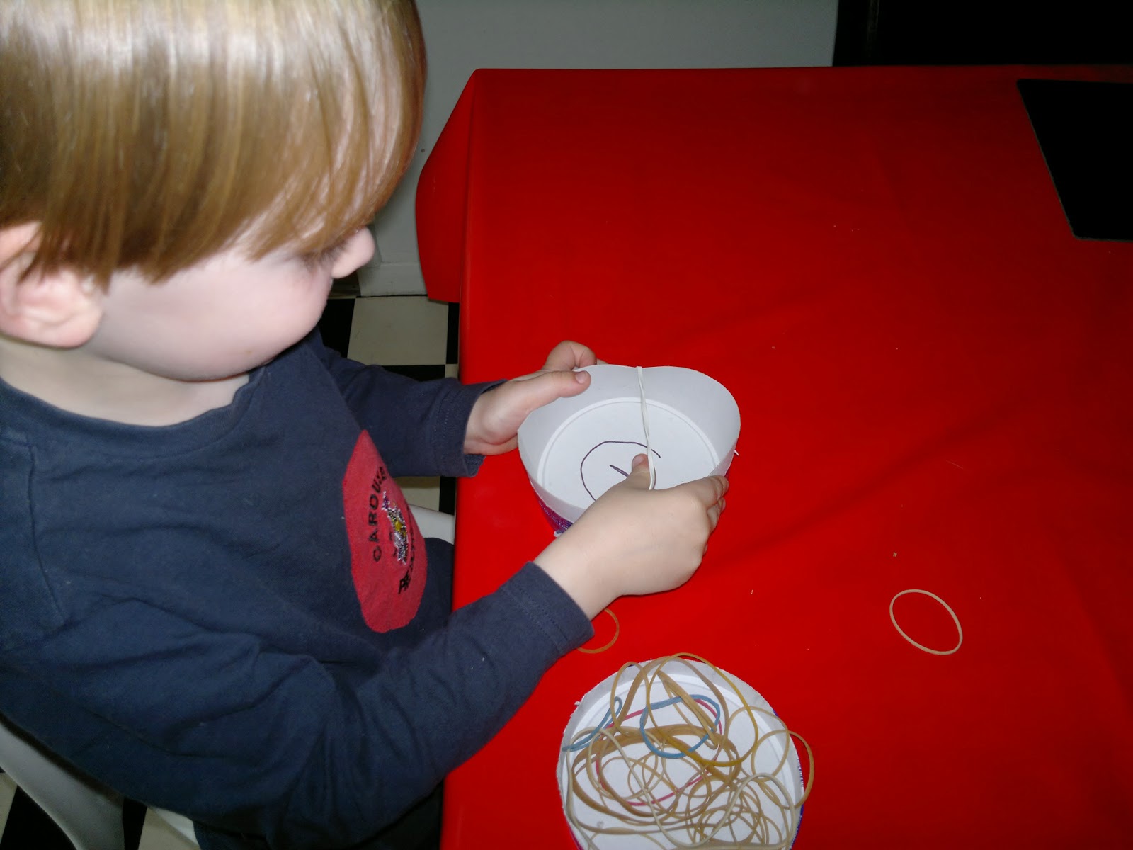 I wrote a G on the cheese triangle box to reinforce G for guitar. Joseph was able to stretch