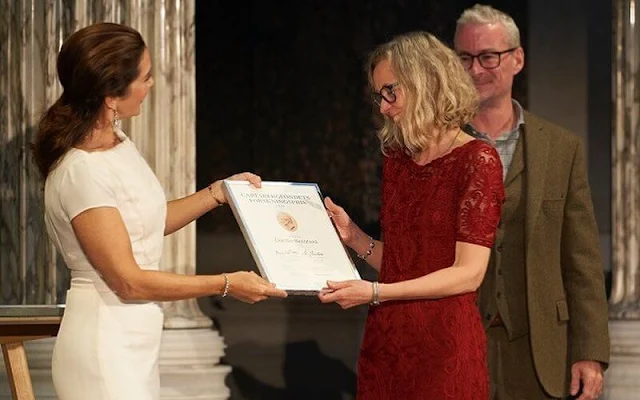 Crown Princess Mary wore a white dress by David Andersen, and Paris white leather pumps by Gianvito Rossi