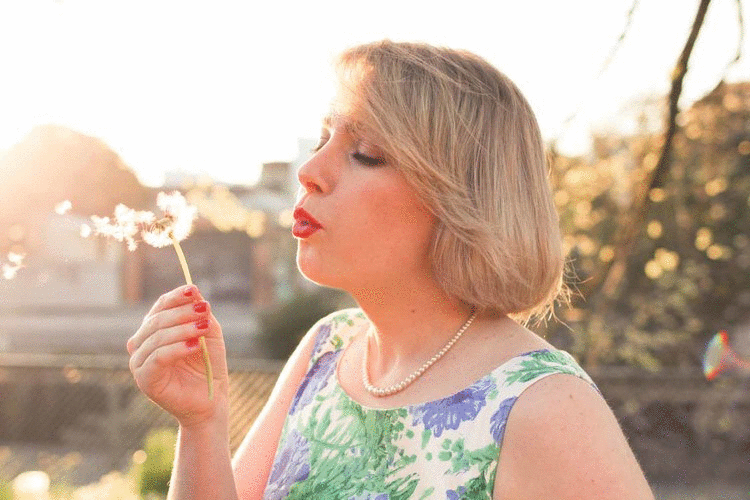 @findingfemme wears blue and green floral dress.