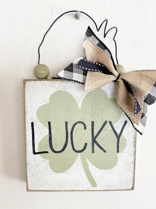 lucky sign with a bow and a wire hanger