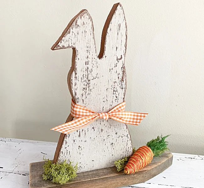 chippy bunny on a stand with a bow and carrot