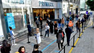 Hundreds line as shops revive in England
