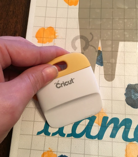 Add a touch of whimsy to a nursery with DIY painted llama pom pom wall art made with vinyl and Cricut.