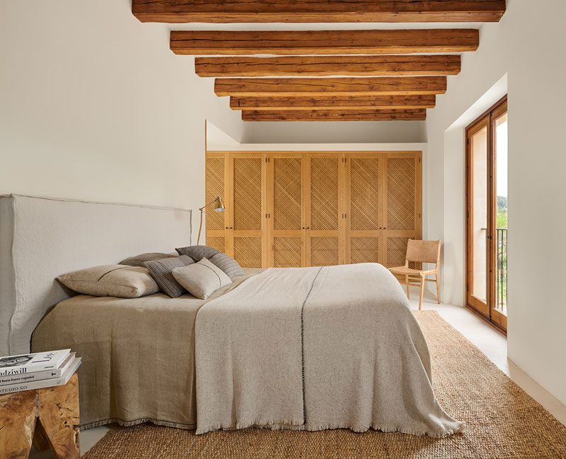 Clean and natural interiors of a stone house in Spain by Jorge Bibiloni Studio