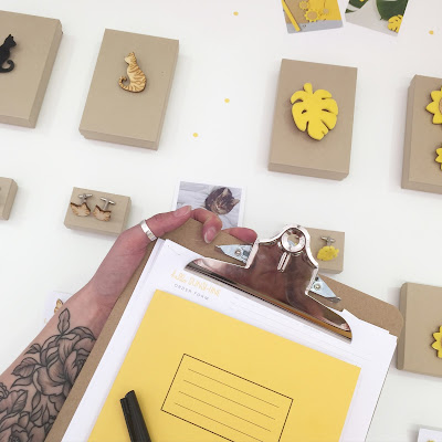 Behind the scenes shot at BCTF Birds eye view of laser cut jewellery and yellow notepad