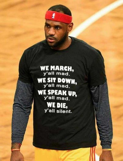 We March y all mad We Sit Down y all mad We Speak 'We March, y'all mad. We Sit Down, y'all mad. We Speak Up, y'all mad. We Die, y'all silent.' t-shirt as worn by Lebron James.  PYGear.com