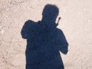 Photographer Shadow On Tropical Beach Sand On A Sunny Day At The Village