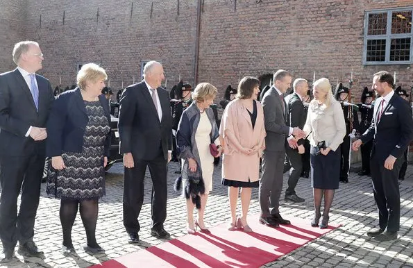 Crown Princess Mette-Marit, Gudni Johannesson and Eliza Reid at the Akershus Fortress. Crown Princess Mette Marit wore Valentino Ruffle trimmed wool and silk blend jacket