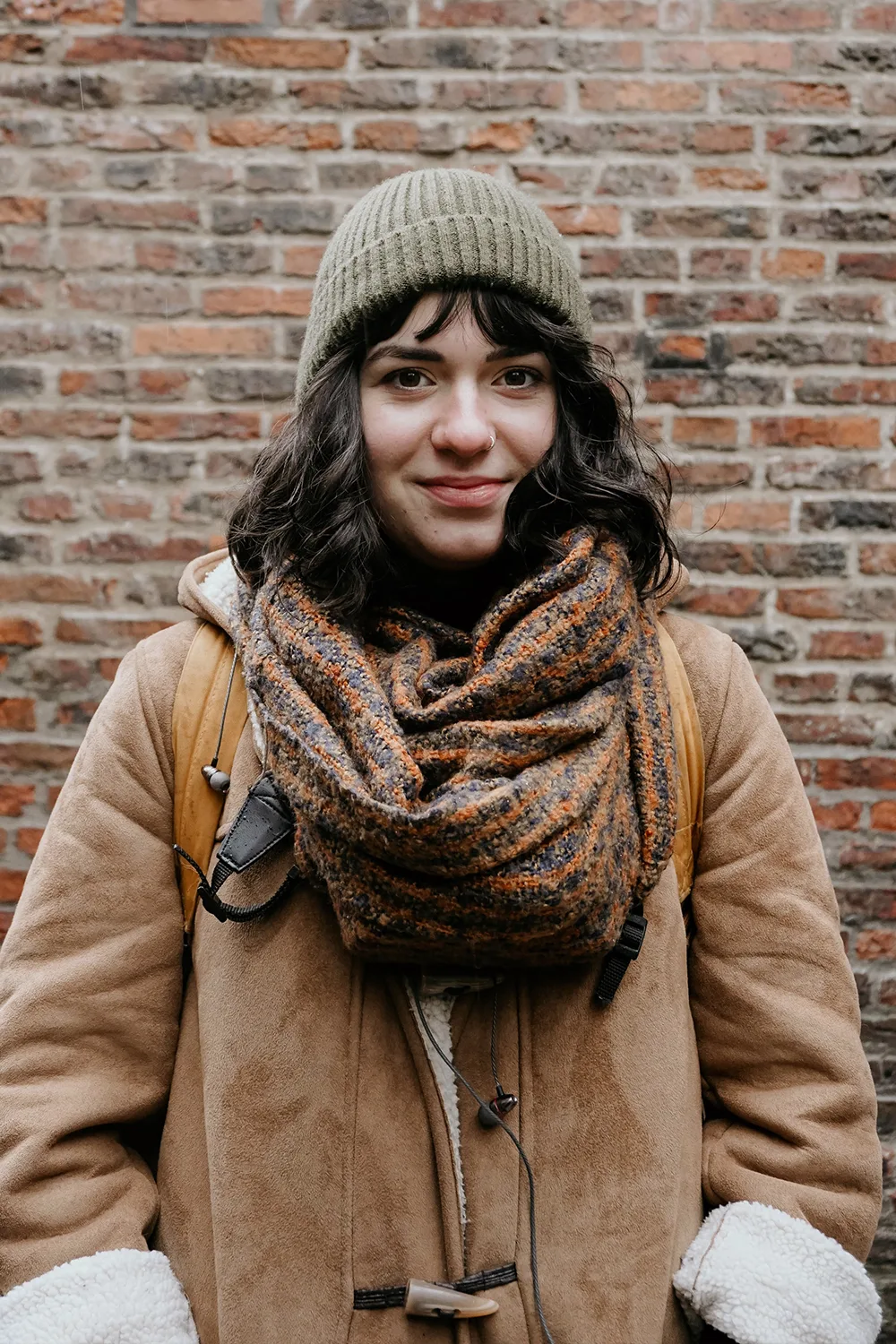 a woman wearing fall outfit with an infinity scarf