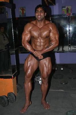 Varinder Singh Ghuman in gym posing 