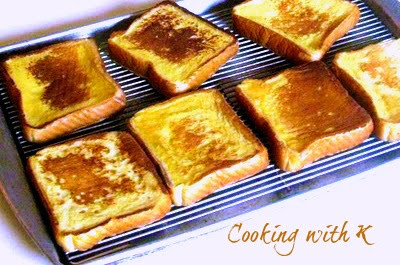 Texas Style French Toast, thick sliced bread dipped in egg batter with heavy cream and vanilla bean paste.  Secrets to feeding a crowd french toast and it does not get soggy.