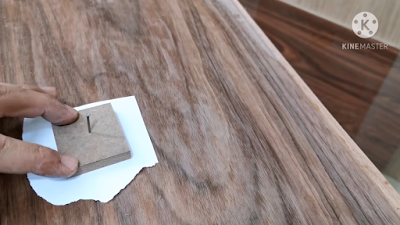 علاج التقبيب في القشرة الخشب بإستخدام قطعة خشب عليها مسمار