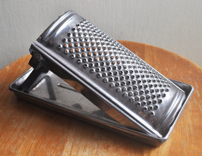 Italian grater for cheese, with tray