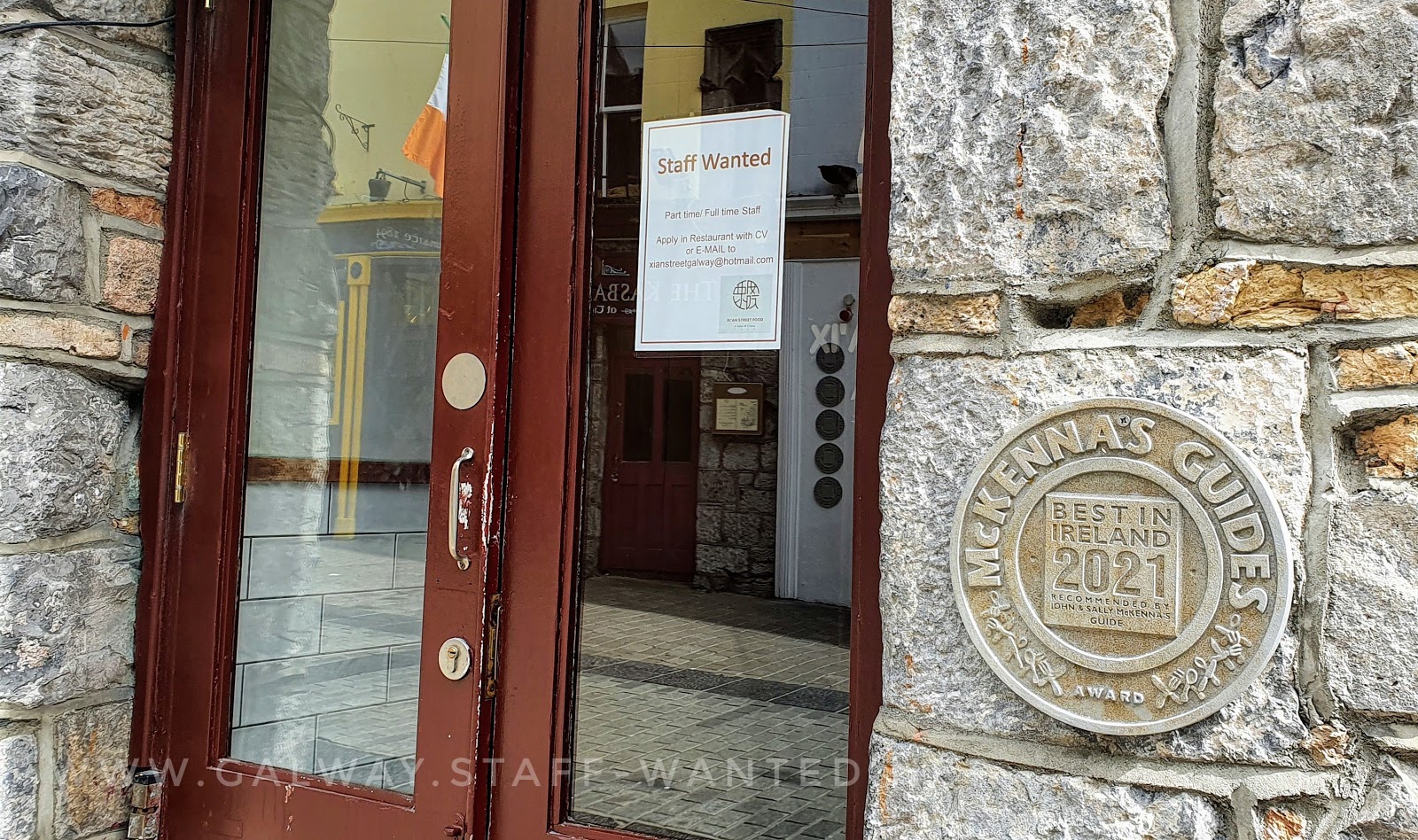 Stonework restaurant with McKenna's Guides 2021 plaque beside the door