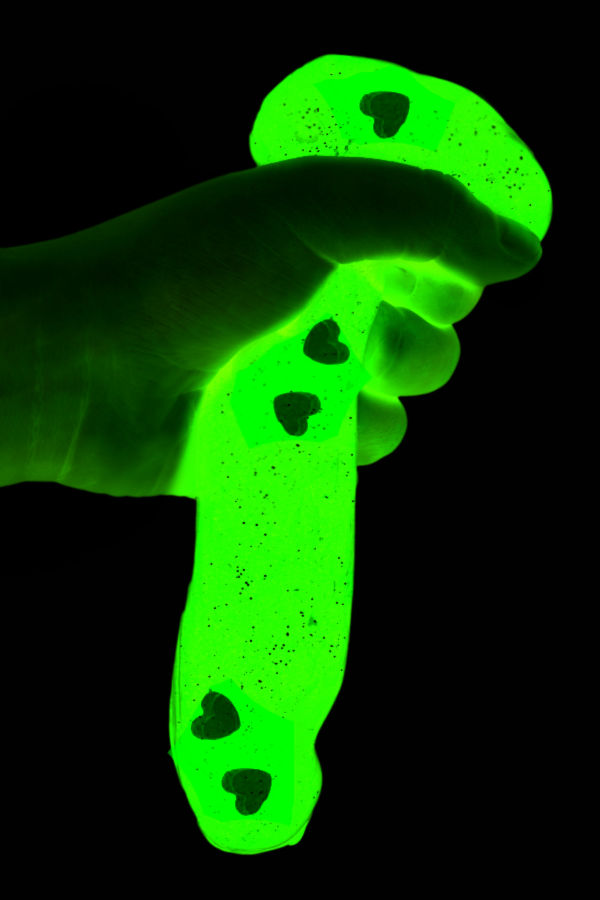 Wow kids of all ages and make glow-in-the-dark Grinch slime!  This recipe is so easy & perfect for the holidays! #grinch #grinchslime #grinchslimerecipe #grinchslimekids #grinchslimediy #grinchactivities #grinchcraftsforkids #glowinggrinchslime #glowinthedarkgrinchslime #christmasslime #slime #growingajeweledrose #activitiesforkids