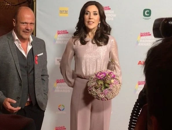 Crown Princess Mary wore a baby pink high waist wide leg trousers. Diane von Furstenberg pink sequin top, Bottega Veneta