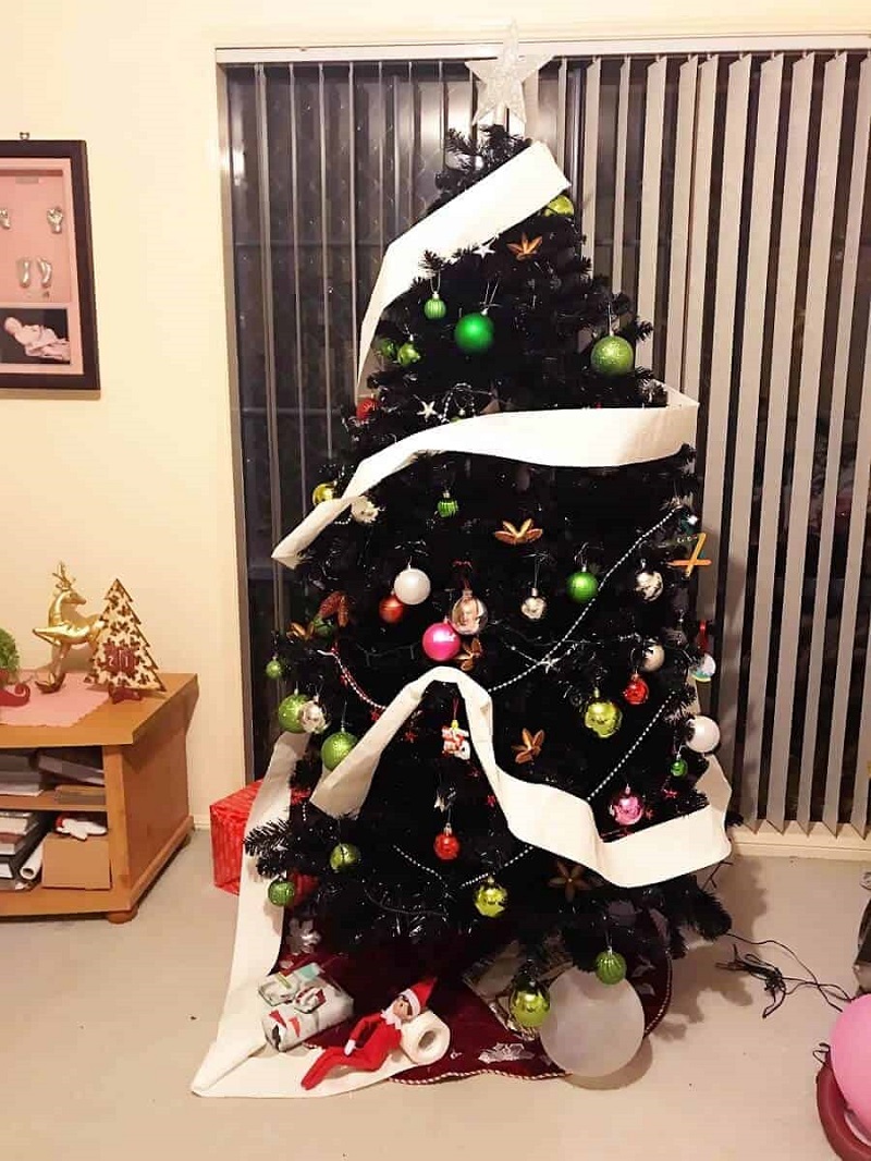 christmas tree wrapped with toilet paper