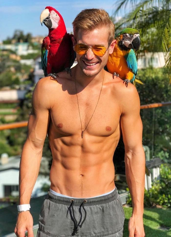 cute-dude-fit-shirtless-body-abs-smiling-huge-parrots-shoulders