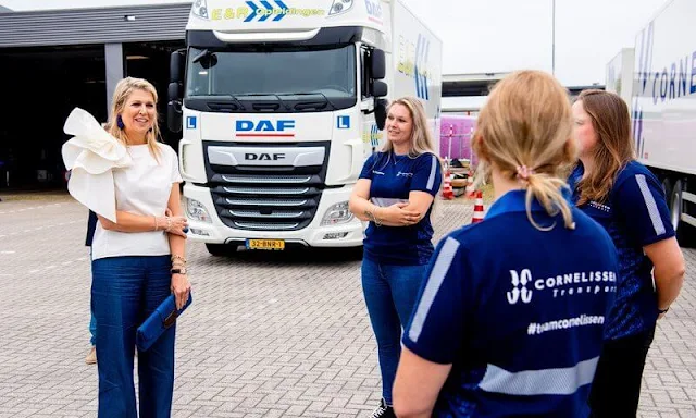 Queen Maxima wore a white silk top from Natan, and navy trousers from Natan. Transport and Logistics sector