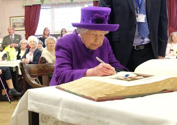 Queen Elizabeth II visited the King George VI Day Centre in Windsor. 60th anniversary of its establishment. The Queen wearing purple coat and hat