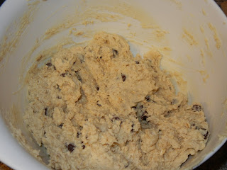 adding chocolate chips to the bowl 