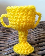 http://www.ravelry.com/patterns/library/tiny-cup-trophy