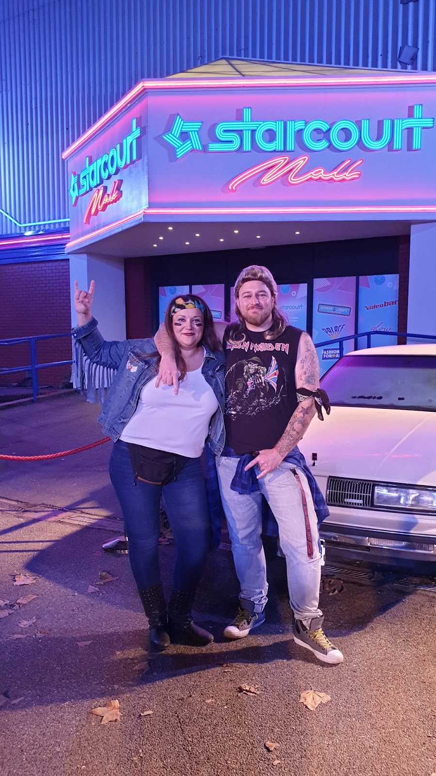 couple dressed as 80s rockers at secret cinema