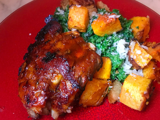 Baby Back Ribs in Orange BBQ Sauce with Roasted Butternut Squash on Kale Salad. By Nicole Ruiz Hudson