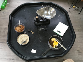 tuff tray with baking resources and vintage weighing scales