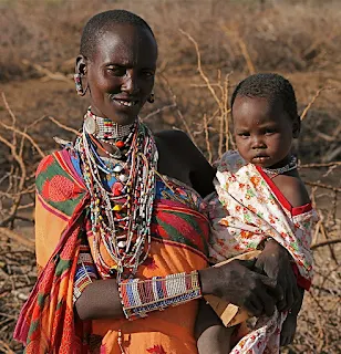 Mom and baby living on the earth under the sky in Kenya