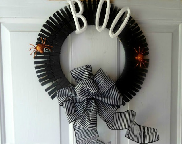 a black halloween wreath made from clothespins