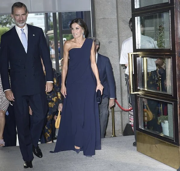 Queen Letizia wore Pedro del Hierro jumpsuit and Nina Ricci pumps, carried Felipe Varela clutch bag