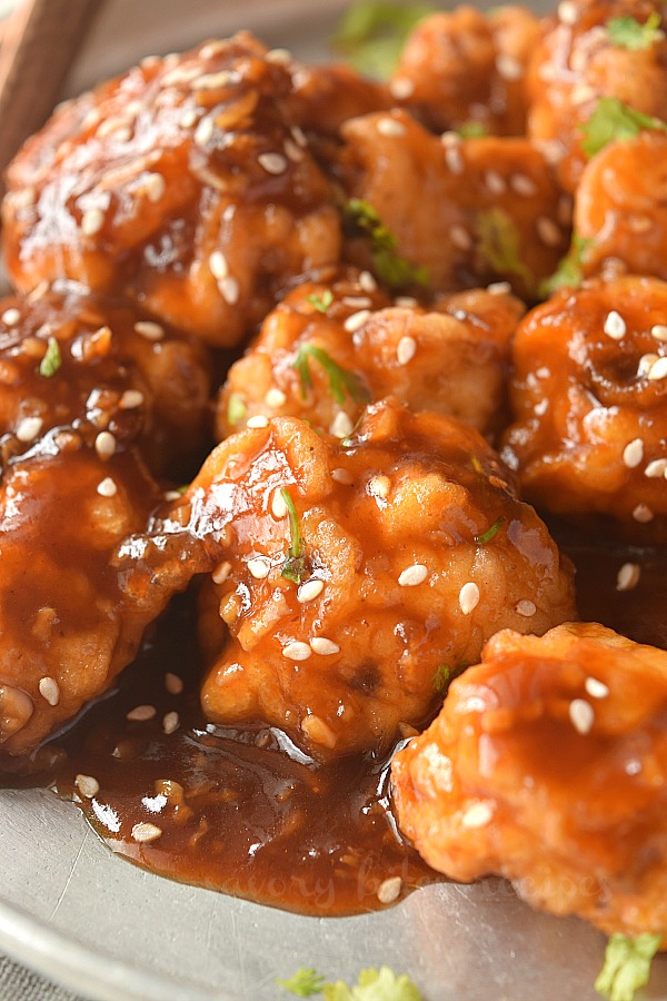 closeup of general tsos cauliflower with sesame seeds served on plate