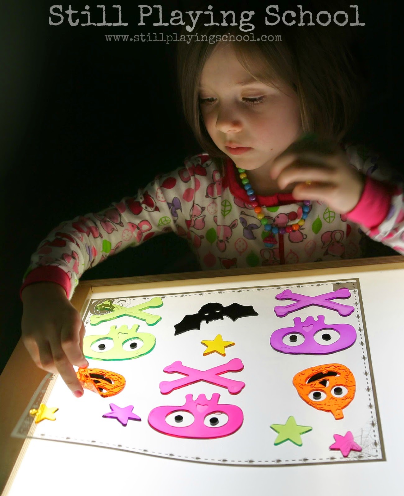 Halloween Shapes on the Light Table Still Playing School