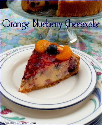 Orange Blueberry Cheesecake, bursting with orange flavor and studded with fresh blueberries. | Recipe developed by www.BakingInATornado.com | #recipe #dessert