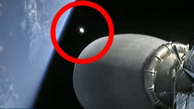 UFO turns away from SpaceX rocket in space when it gets right near it.