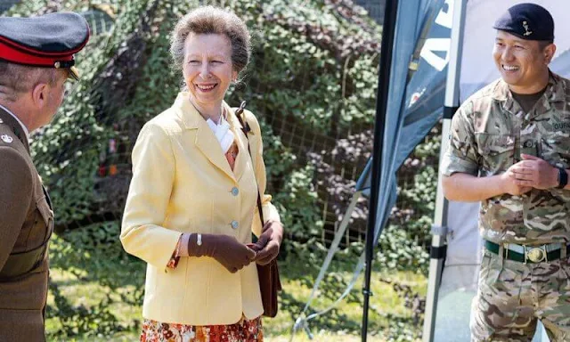 The Princess Royal wore a yellow jacket, blazer and floral print midi skirt or dress. Burgundy leather bag and sunglasses