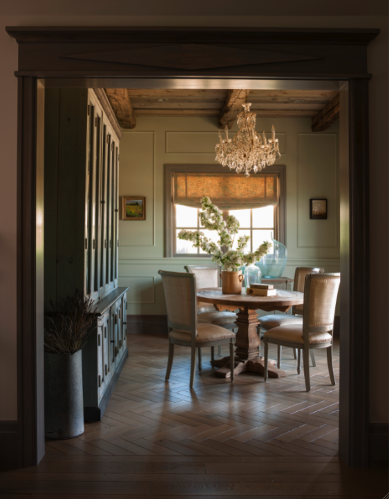 Elegant French country dining room with round table. Come see this Rustic Elegant French Gustavian Cottage by Decor de Provence in Utah! #frenchcountry #frenchfarmhouse #interiordesigninspiration #rusticdecor #europeanfarmhouse #housetour