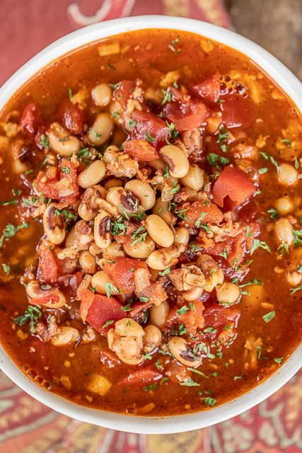 Black-Eyed Pea Soup - a New Year's tradition! Super easy to make and tastes GREAT! Ready to eat in about 20 minutes. Bacon, canned black-eyed peas, onion, garlic, chili powder, diced tomatoes & green chiles, chicken broth, salt, and pepper. Serve with some biscuits or cornbread. Comfort food at its best! #soup #stew #blackeyedpeas #chili bowl of soup