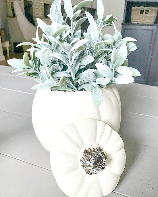 faux pumpkin centerpiece for fall with plant inside