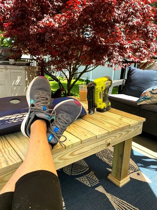 Sitting with feet up on coffee table