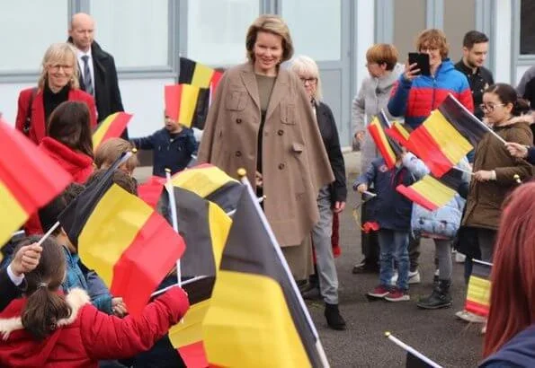 Queen Mathilde visited the 'Fly to the Moon' project of Maison des Ateliers Mons. Natan dress and Armani wool coat