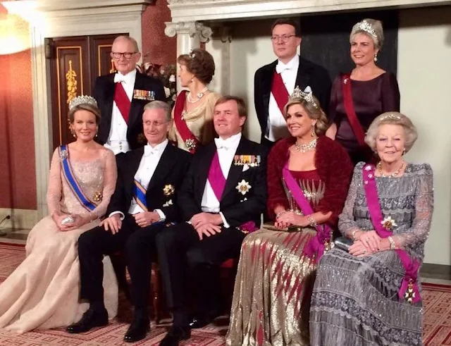 Queen Maxima wears the tiara Mellerio Rubies and wore Jan Taminiau Gown. Queen Mathilde wearing a new powder pink gown with long sleeves by Pierre Gauthier. Princess Beatrix wears Diamond Bandeau tiara. Jewelry Princess Margriet, Princess Laurentien wearing a dark brown dress Talbot Runhof.