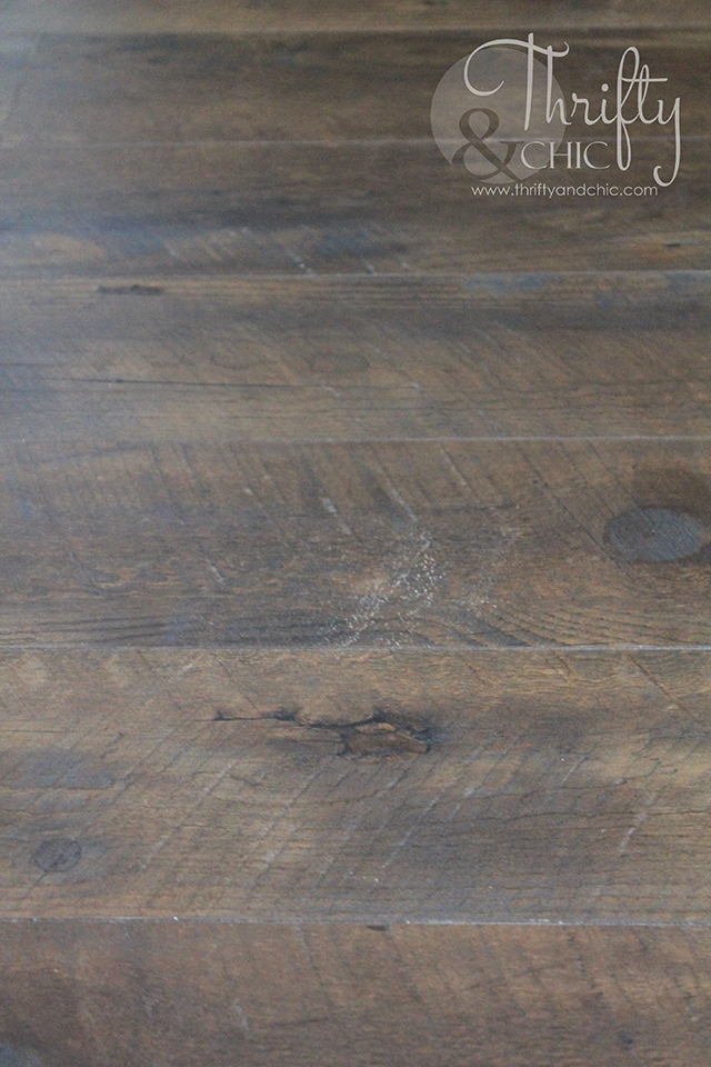 Why we chose laminate versus hard wood flooring. Plus, a glimpse into the installation process!