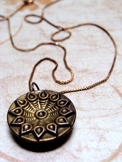 antique gold necklace pendant with solar flower design