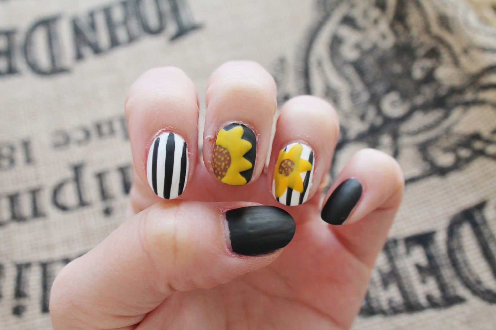 yellown nail design with sunflower