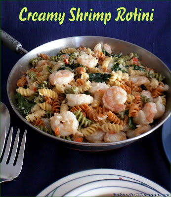 Creamy Shrimp Rotini, fresh shrimp and vegetables are mixed with pasta and served in a creamy sauce. | Recipe developed by www.BakingInATornado.com | #recipe #dinner